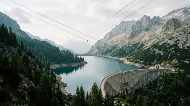 Incidente in Valle Antrona: lago artificiale di montagna con diga e cavi tesi sopra il bacino